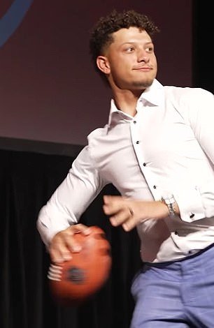 Mahomes throws the ball to Kelce during his charity gala