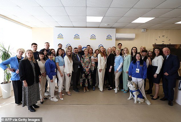 Sophie poses for a photo with people at the UNPFPA office, with the Duchess 'keen to show her solidarity with the men, women and children affected by the Russian invasion'