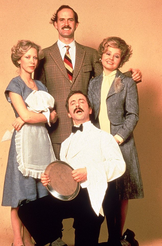 From left to right: Connie Booth as Polly, John Cleese as Basil Fawlty, Prunella Scales as Sybil Fawlty and Andrew Sachs (kneeling) as hapless Spanish waiter Manuel in a promotional photo