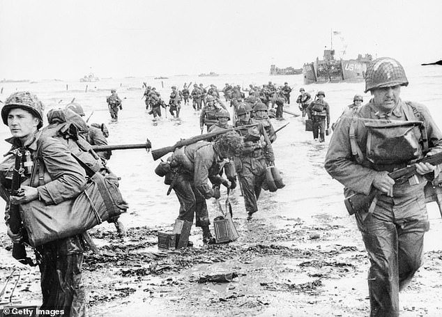 American assault troops seen here landing on Omaha beach during the invasion of Normandy on June 6, 1944