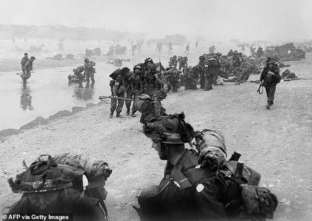 British troops take up positions on Sword Beach during D-Day June 6, 1944 after Allied forces storm the beaches of Normandy
