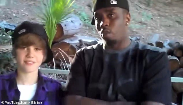 Other fans feared Justin's meltdown was linked to his childhood friendship with controversial rapper P Diddy (pictured together in old footage when Justin was 15)