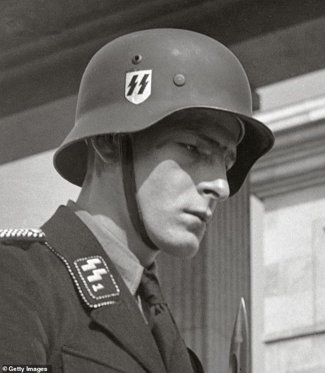 An SS logo can be seen on the clothing of a German soldier circa 1935 (File image)