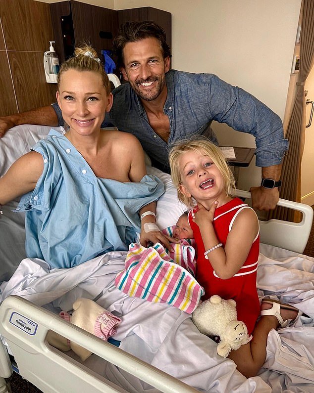 Anna Heinrich from Bachelo has revealed that she recently faced a life-threatening situation during the birth of her second daughter, Ruby.  Pictured with husband Tim Robards, 41, and eldest daughter Elle, two