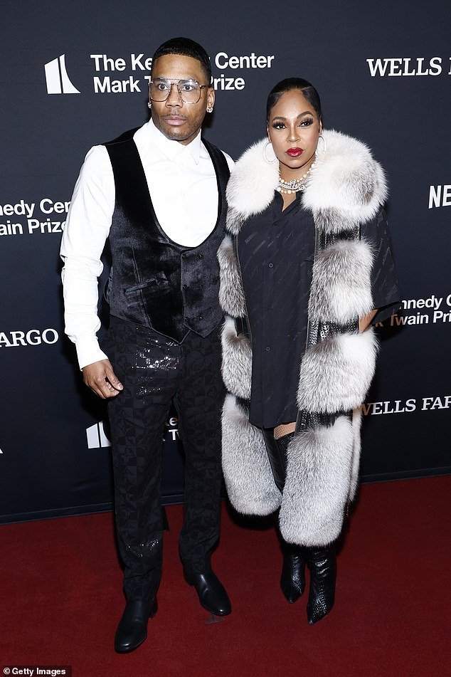 Ashanti has finally confirmed she is expecting her first child with fiancé Nelly (pictured last month in Washington, DC)