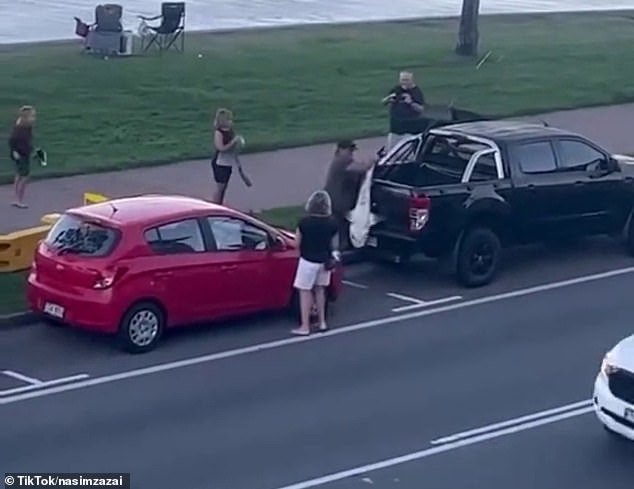 The man's first attempt to hoist him onto the back of his SUV was unsuccessful, but he succeeded the second time