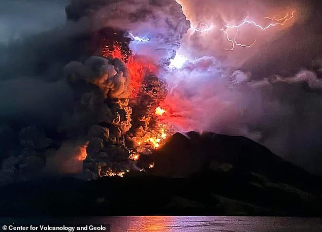 Australia has been warned of a tsunami after Indonesia's Mount Ruang stratovolcano (pictured), in North Sulawesi province, spectacularly erupted five times in 24 hours