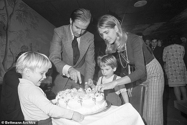 In this file photo, Senator-elect Joseph Biden and his wife Nelia cut his 30th birthday cake at a party in Wilmington, November 20, 1972, with their two sons Hunter and Beau