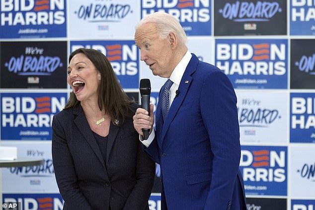 President Joe Biden speaks at an organizing event as Nikki Fried laughs