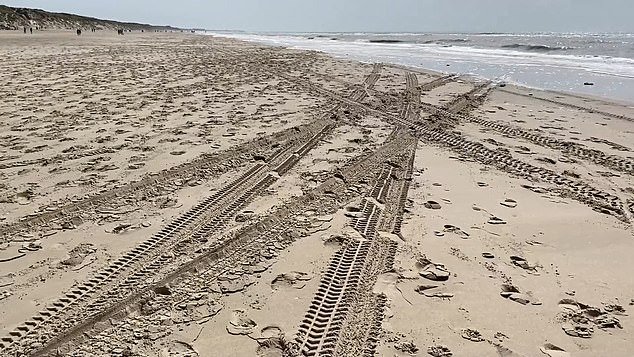 The Briton reportedly drifted through the sand at high speed as tourists sunbathing on the beach of Le Touquet, in the Pas-de-Calais region of northern France, tried to get to safety (photo: the tire tracks in the sand after the joyride)