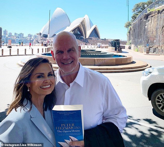 Lisa Wilkinson is pictured with Peter FitzSimons holding a copy of his book 'The Opera House'