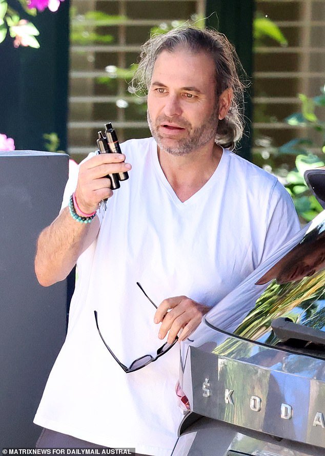 Bruce Lehrmann's flatmate, Mr Farrell, is pictured outside the North Sydney rental home on Thursday