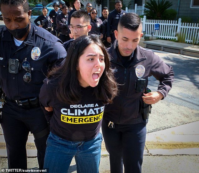 Climate activist protests against Kamala Harris outside her home in Brentwood, CA