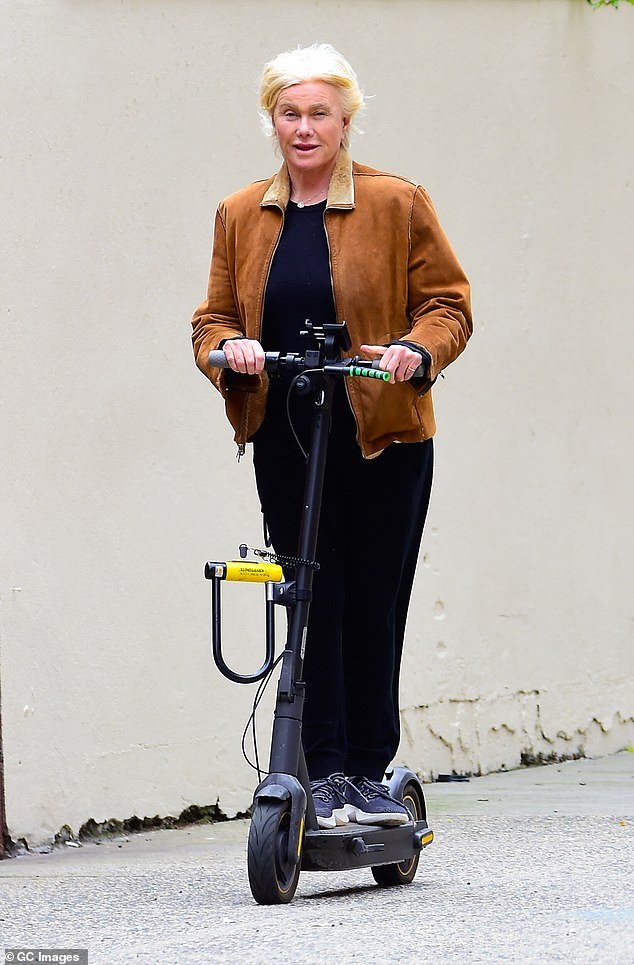 Newly single Deborra-Lee Furness, 68, (pictured) looked like a woman living her best life on Monday as she took to the streets of New York on her electric scooter