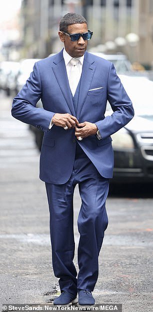 Denzel Washinton, 69, looked handsome in a blue three-piece suit for his scene on the streets of New York