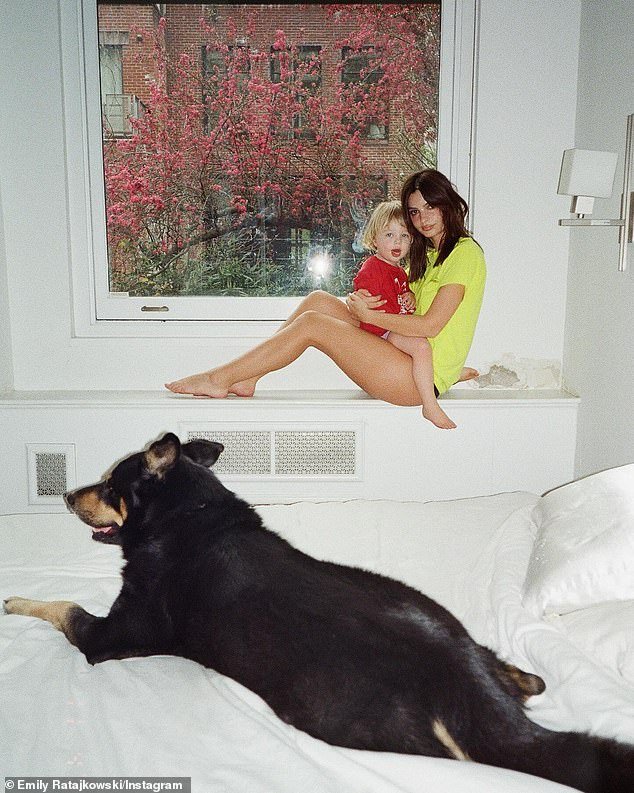 Emily Ratajkowski and her 'beautiful baby' Sylvester Apollo Bear coordinated in T-shirts and underwear for a family photo shoot in her West Village apartment alongside her fur baby Colombo