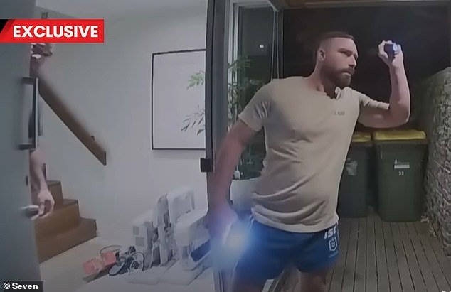 Julian Rivers-Smith, 33, was confronted by an armed gang after inviting a potential buyer to pick up a laptop from his Melbourne home.  The confrontation was captured on CCTV at home