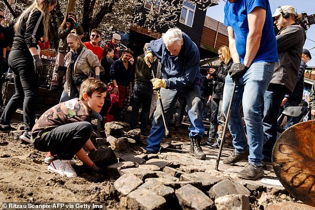 Young children and elderly residents were among those destroying the cobblestones of Pusher Street
