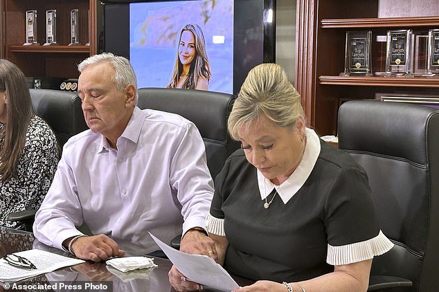Paul and Julie Page speak to reporters in Las Vegas on Monday, April 15, 2024, as a photo of their daughter Ashley Prince is projected on a screen behind them