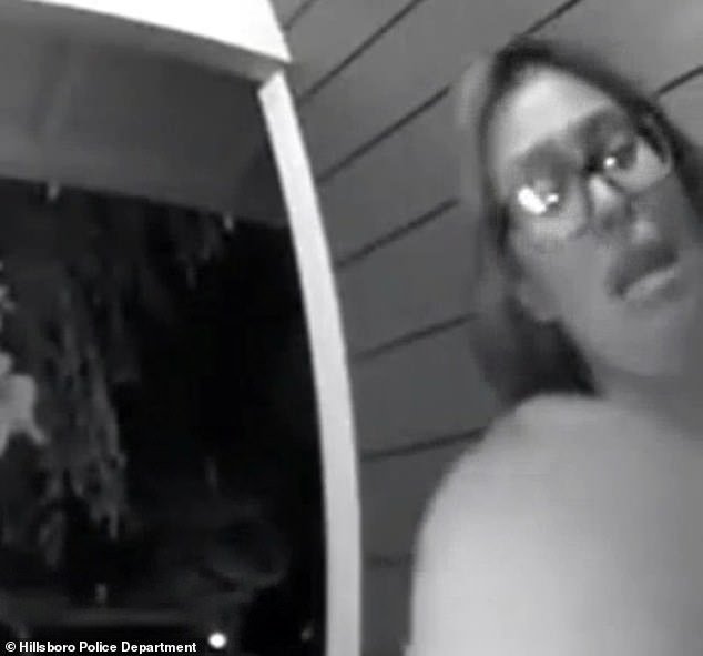 The woman is seen running to a stranger's house and ringing the doorbell on Sunday
