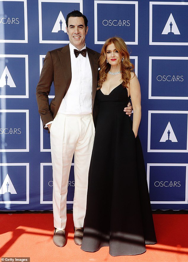 Sacha Baron Cohen and Isla Fisher have announced their shock split after 14 years of marriage in a bizarre statement that saw the pair wearing tennis outfits - amid the controversy surrounding Cohen's name in Rebel Wilson's bombshell memoir.