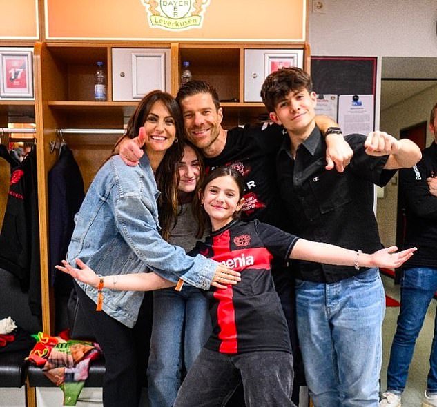 Xabi Alonso poses with wife Nagore and their three children Jontxu, Ane and Emma after Bayer Leverkusen won a historic Bundesliga title last weekend