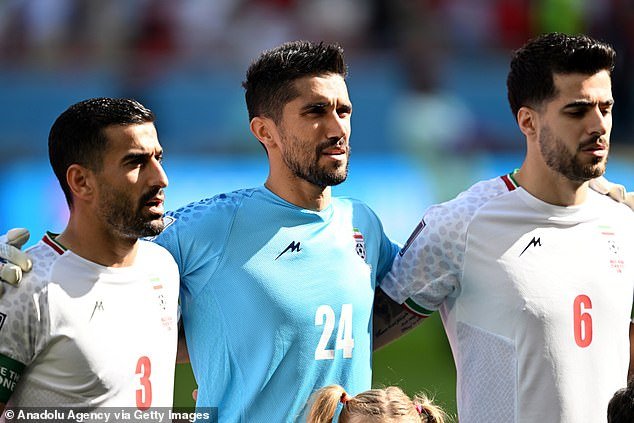 Hossein Hosseini (center) was reportedly given a one-match ban for hugging a female fan