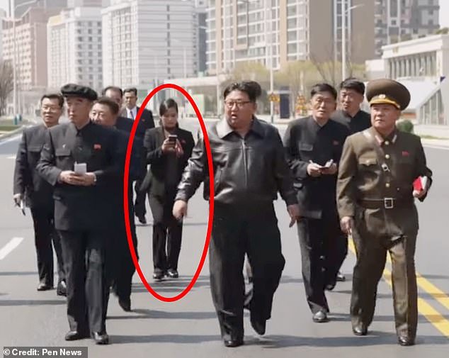 A North Korean pop star (circled) has been spotted with Kim Jong Un amid rumors she is his secret flame and has given birth to his love child
