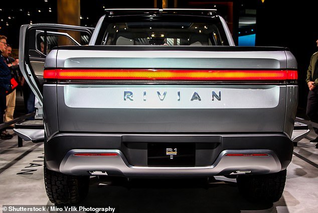The Rivian R1T pickup (pictured) has seen a $3,100 price cut as global EV sales fall and companies rush to introduce cost-cutting measures