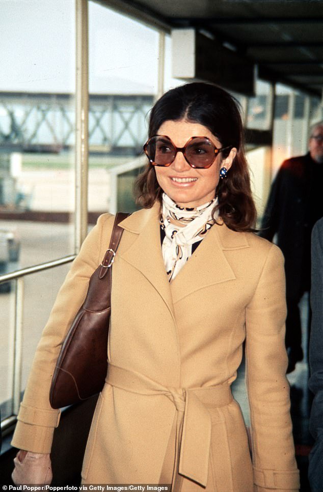 Onassis pictured in 1971 wearing her signature large sunglasses