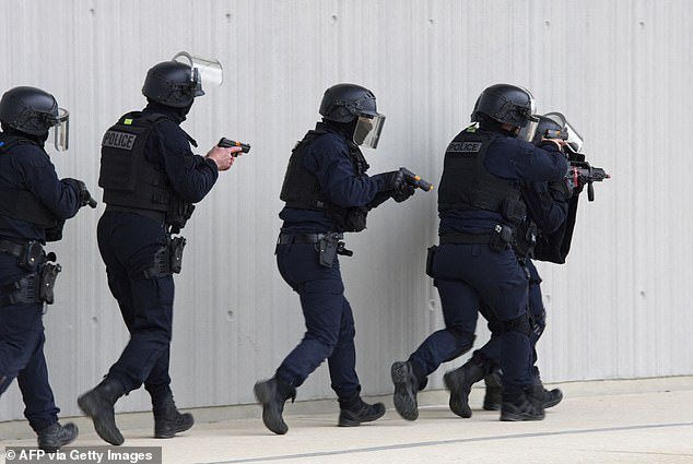 File photo shows French police forces, including the Investigation and Intervention Brigade, raiding the house in Gennevilliers on March 27 and taking part in counter-terrorism exercises
