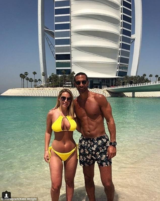 Ferdinand, pictured with his partner Kate in Dubai, called Terry an 'idiot' in his autobiography