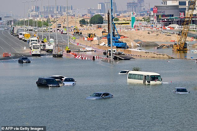 Cars are stranded on a flooded street in Dubai after heavy rain on April 18, 2024