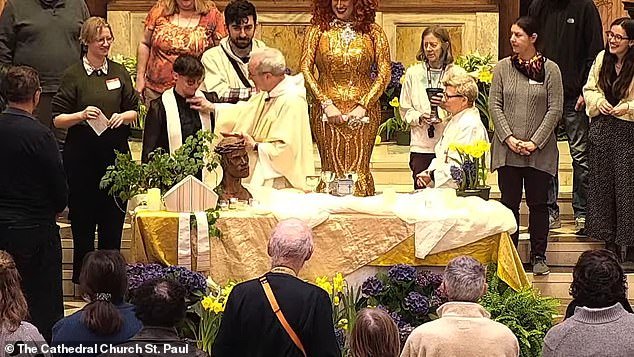 Bishop Alan Gates (in white chasuble) ripped the clerical collar from Rev. Tamra Tucker's neck after Tucker (Gates' left) forgot the words for the church service