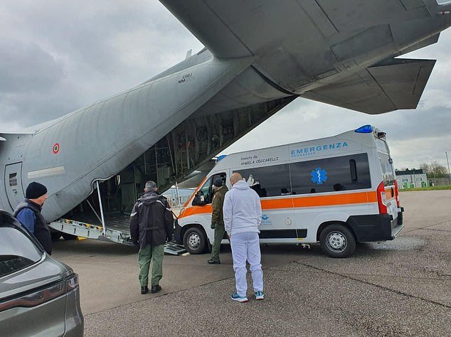 A specially adapted ambulance is loaded onto a plane with military and medical personnel ready to fly to Bristol to collect the serious baby from Bristol Royal Hospital for Children
