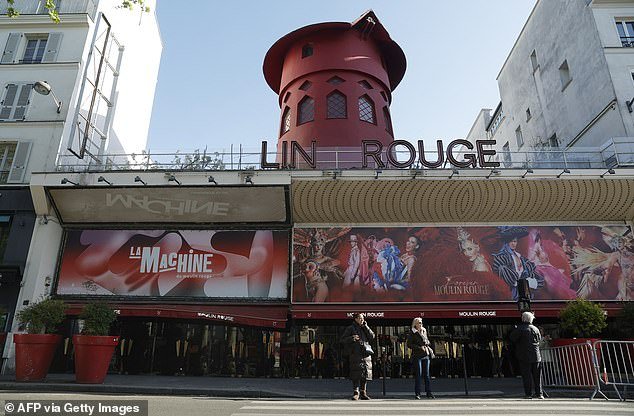 The blades of the famous windmill of cabaret club Moulin Rouge in Paris have fallen off