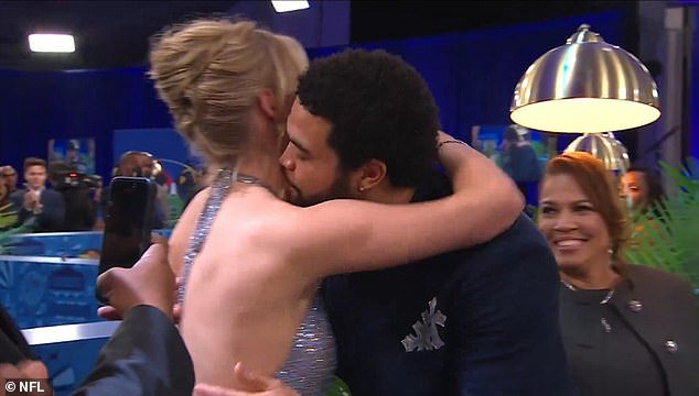 The couple shared a loving embrace on camera after Williams' name was called in the Draft