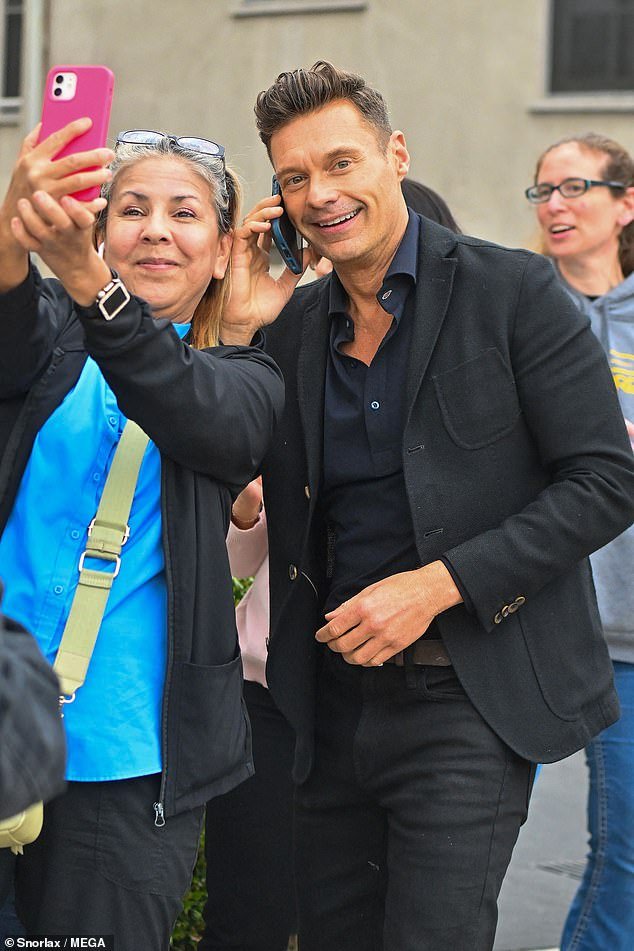 Newly single Ryan Seacrest, 49, looked happier as he stepped out to celebrate his 20th anniversary with KISS FM!  on Friday — in his first public sighting since splitting from Aubrey Paige, 27