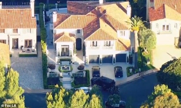 A brave Newport Beach homeowner stood guard over his $5 million mansion after two daring intruders tried to enter his property around 4:45 a.m. Tuesday