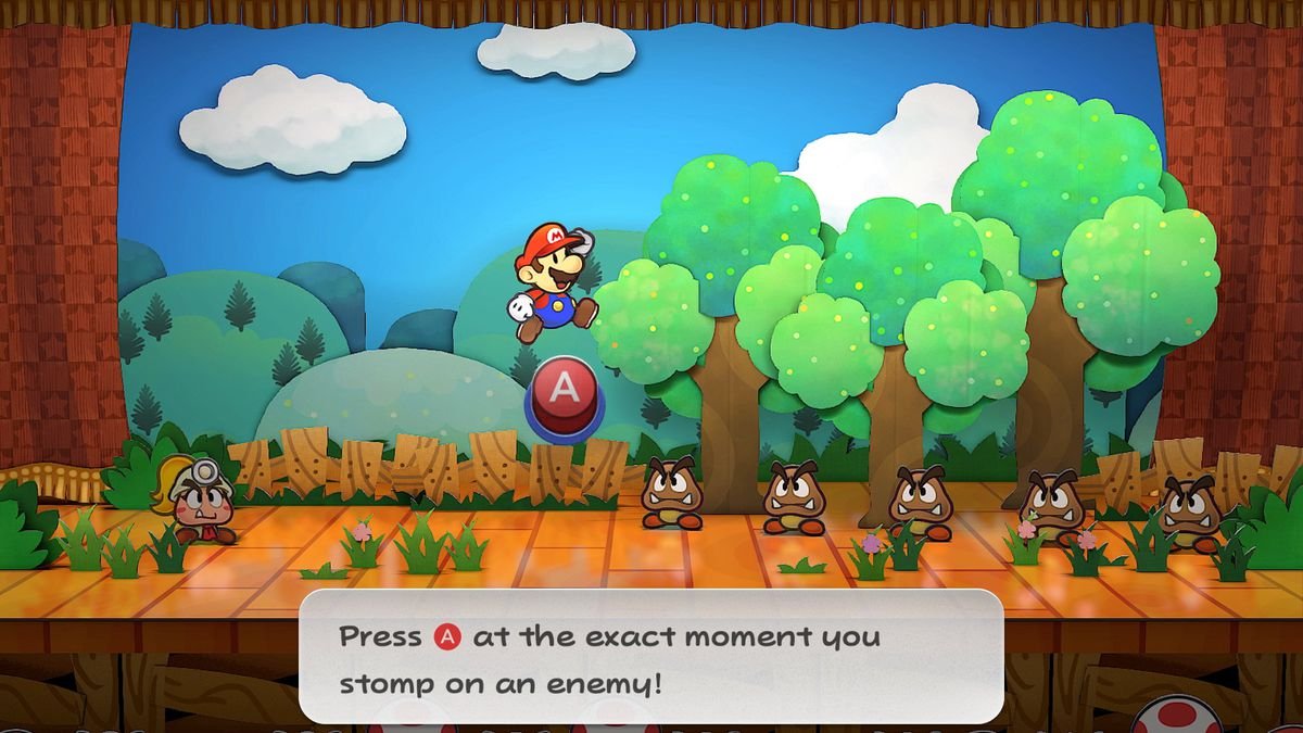 Mario jumps at a group of Goombas during a stage battle in Paper Mario: The Thousand-Year Door