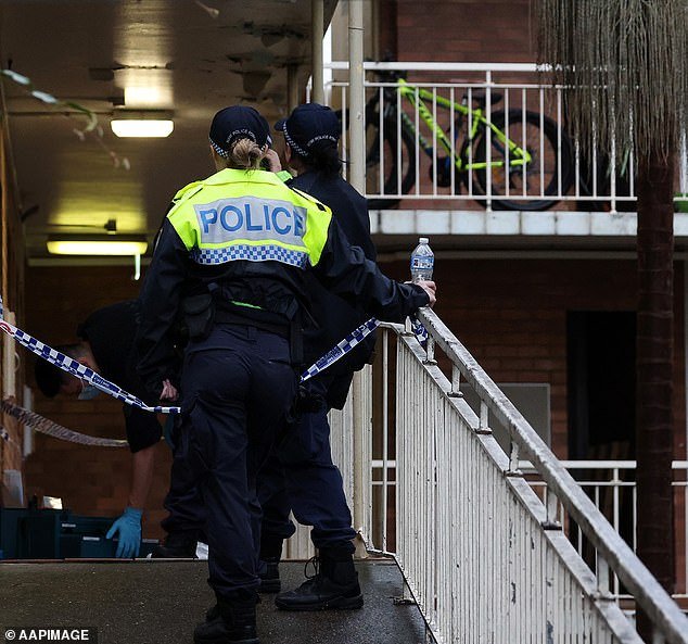 Police have roped off the entrance to the large residential complex in Sydney's eastern suburbs