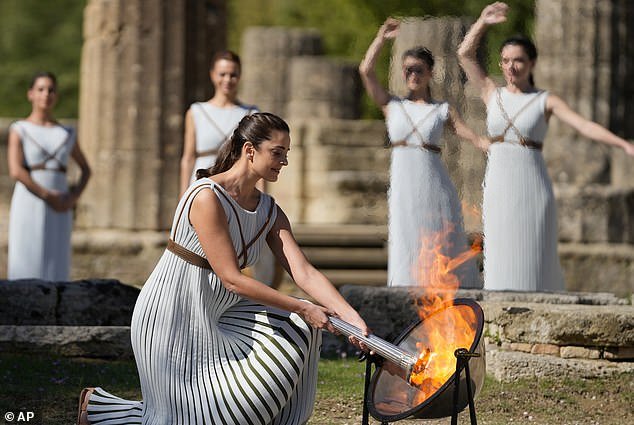 Olympic torch is lit in spectacular ceremony in ancient Olympia