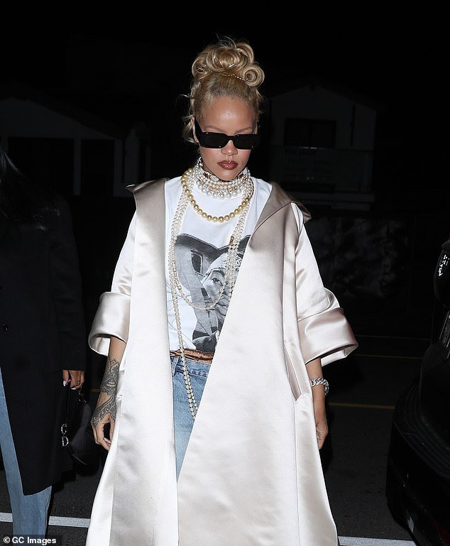 The 36-year-old singer turned heads in the oversized number which she paired with several statement pearl necklaces as she arrived for dinner at Giorgio Baldi.