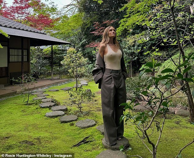 Rosie went braless in a figure-hugging top and wide-leg trousers in Instagram photos shared while in Tokyo on Thursday - her 37th birthday