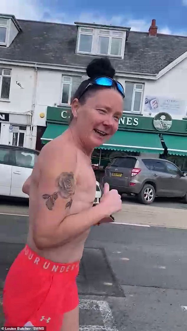Louise Butcher, 50, often runs around her Devon village topless to reduce the stigma surrounding the bodies of breast cancer survivors.  This week she is preparing for the London Marathon