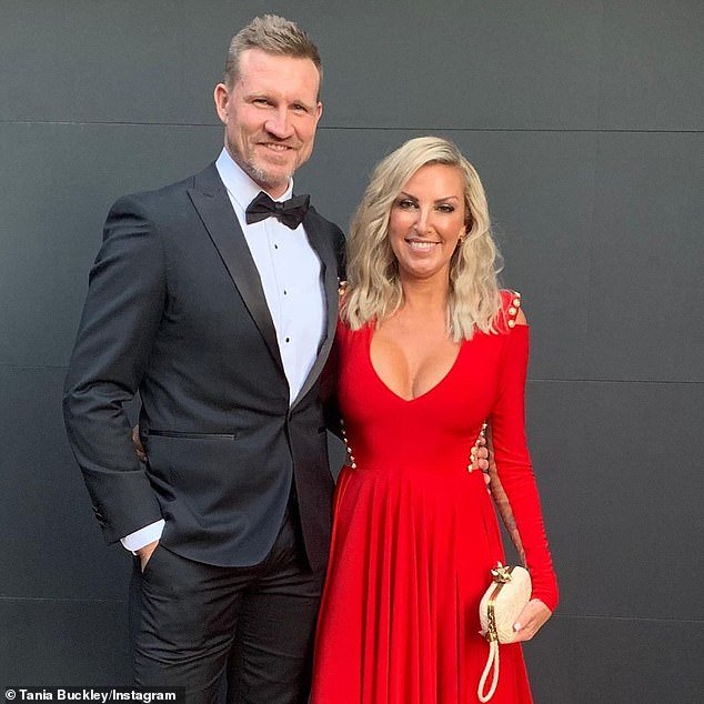 AFL legend Nathan Buckley has auctioned off some of his most prized possessions following his 'traumatic divorce' from ex-wife Tania Minnici (pictured together)