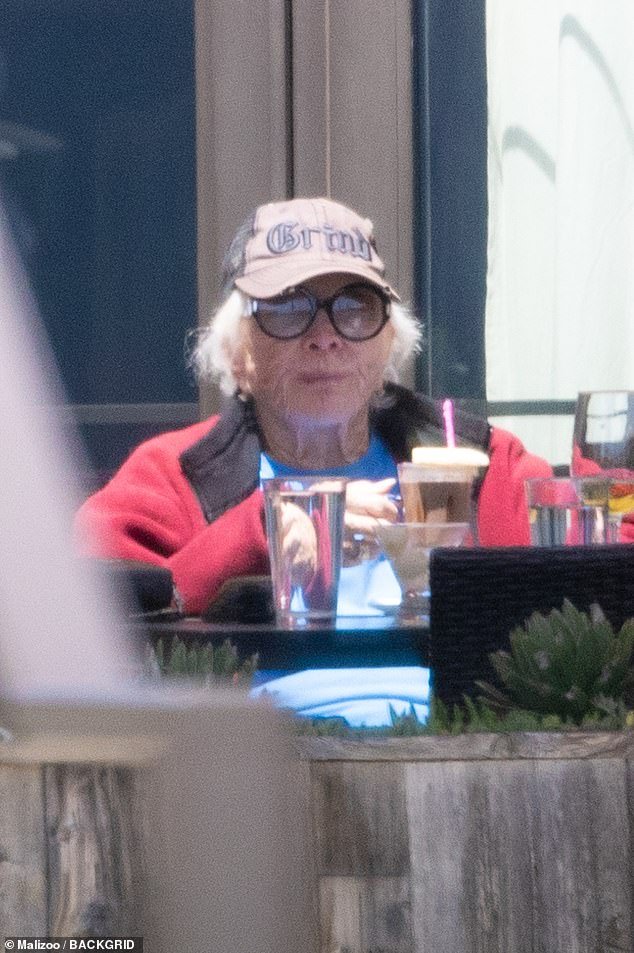 The Oscar winner wore a trucker cap over her white hair and she wore black glasses for her low-key celebrations