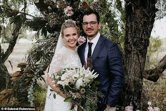 The couple is pictured on their wedding day in 2018