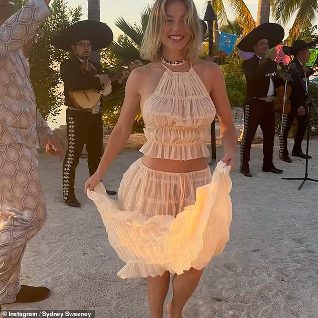 Sydney shared a collection of photos from her outing on social media, including a clip of herself dancing on the beach in a matching ruffled cream