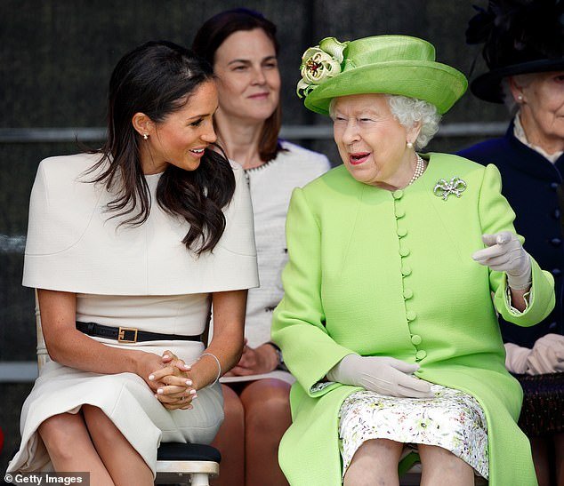 Samantha Cohen sits behind the late Queen and the Duchess of Sussex during a visit to Widnes, Cheshire, in June 2018